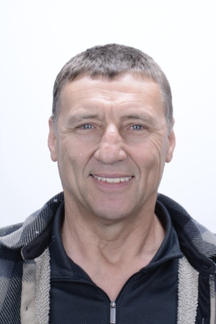 Male patient smiling after dental implant treatment